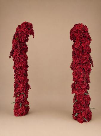 Pair of custom deep red rose and hydrangea arch columns with trailing eucalyptus