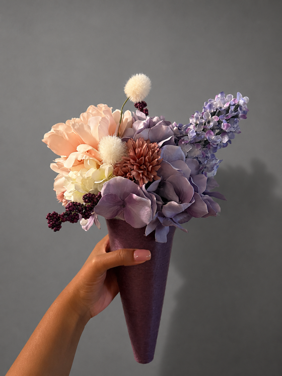 Custom bridal party bouquet in a plum cone with peach, lavender, ivory and burgundy flowers