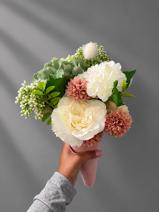Custom bridal party bouquet with ivory blooms, dusty rose flowers and fresh green foliage