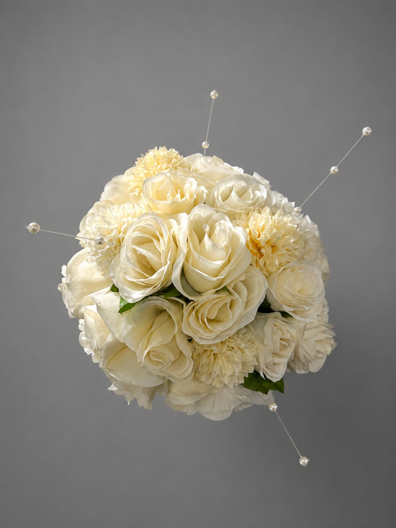 Top view of a custom ivory bridal bouquet with roses, chrysanthemums and pearl sprays